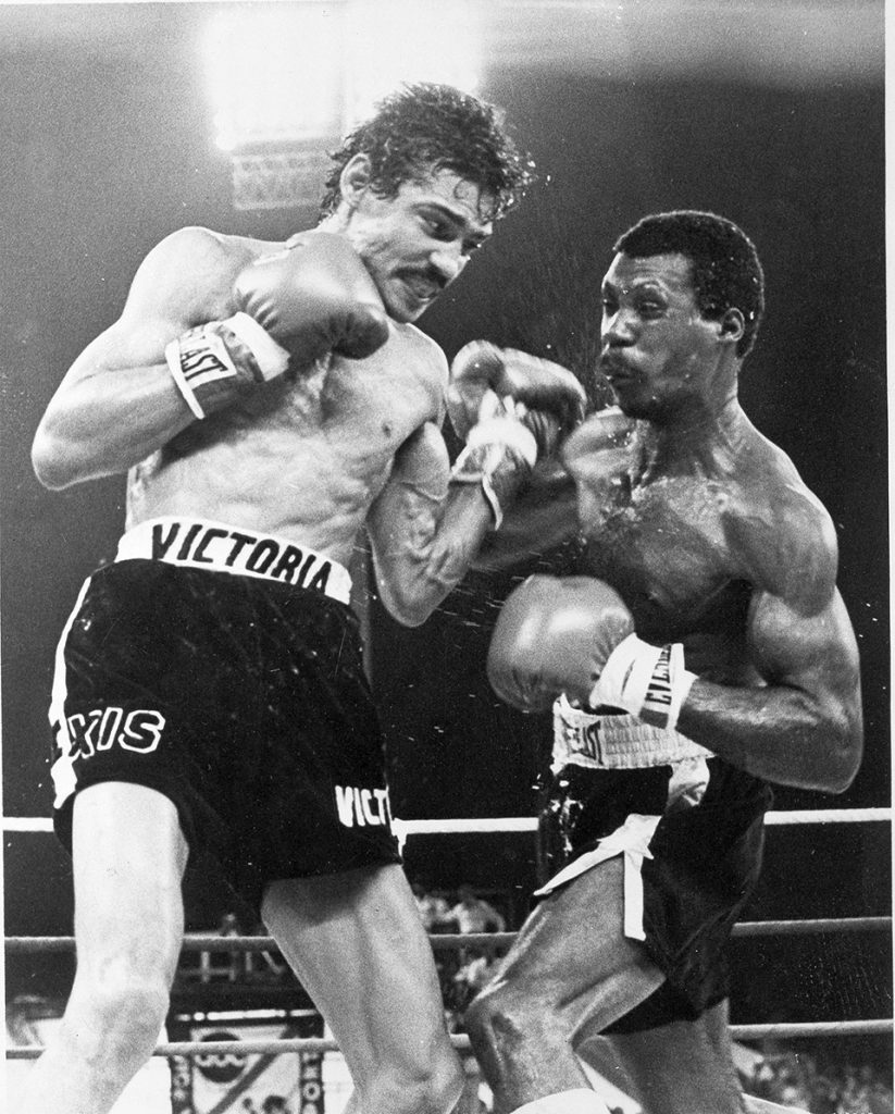 FILE - In this Jan. 28, 1978 file photo, Nicaragua's junior lightweight fighter Alexis Arguello, left, cuts into Puerto Ricos' Alfredo Escalera with a strong left in the ninth round of their World Boxing Council title fight near San Juan. Arguello, three-time world boxing champion, who once fought against the Sandinistas in the 1980s, but joined the party to win election as mayor of Managua in 2008, was found dead Wednesday, presidential spokeswoman Rosario Murillo said. (AP Photo, File)