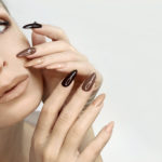 Brown and beige make-up and manicure.